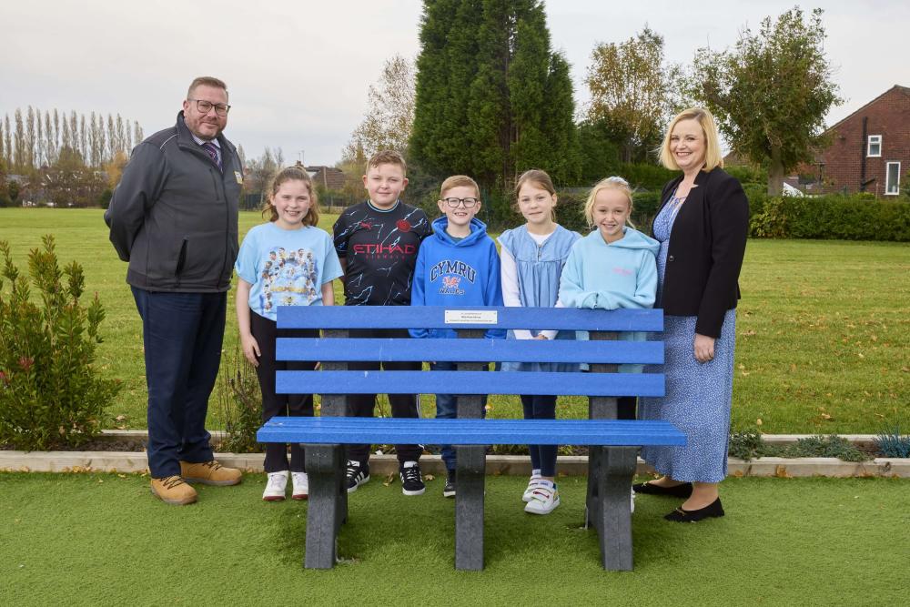 Staff and pupils at Milly-Rose Memorial Garden bench