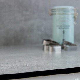 Biscuit tin on grey kitchen worktop
