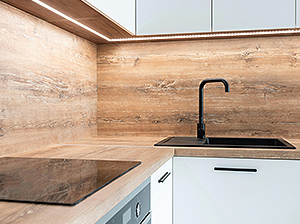 kitchen with wooden worktop and black tap